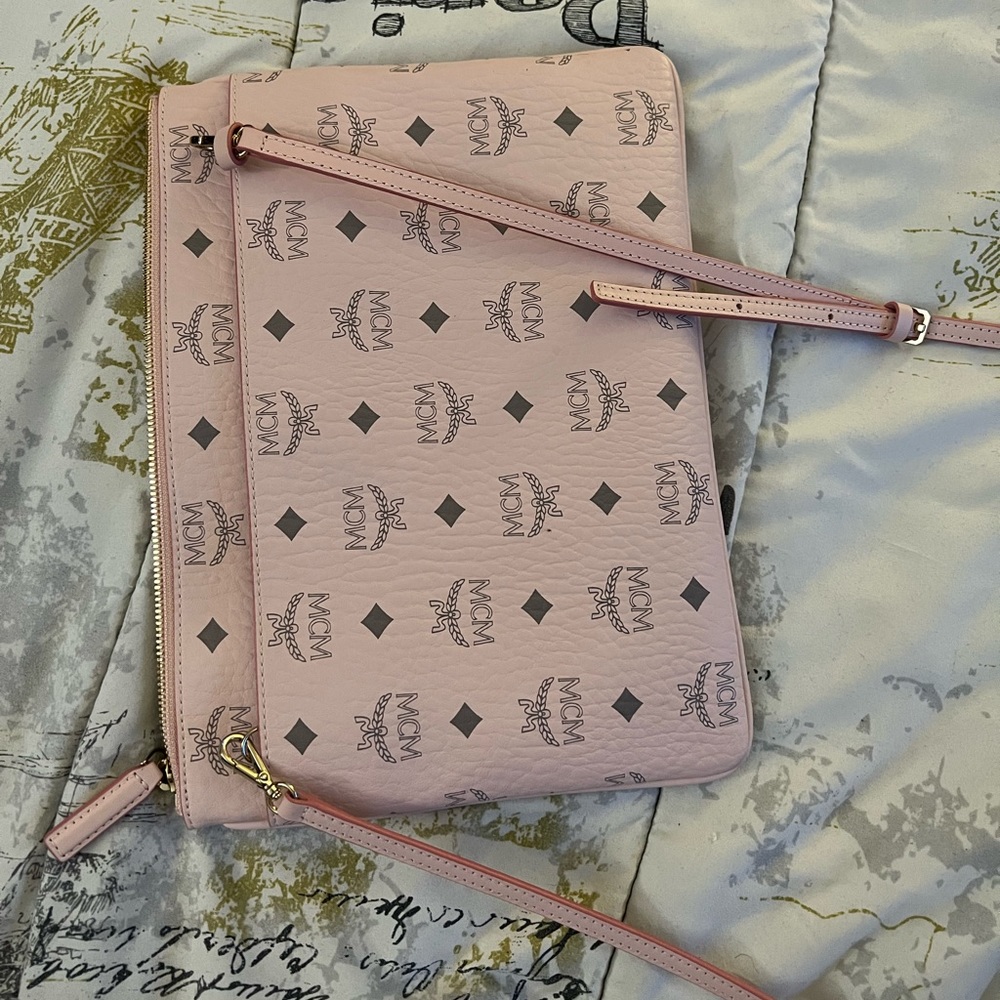 For sale, not sold- like brand new MCM powder pink pouch. Excellent condition